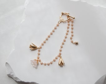 Peach Blossom Bracelet | light pink beaded charm bracelet with dainty flower details