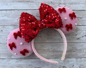 Pink velvet ears with bows and pearls