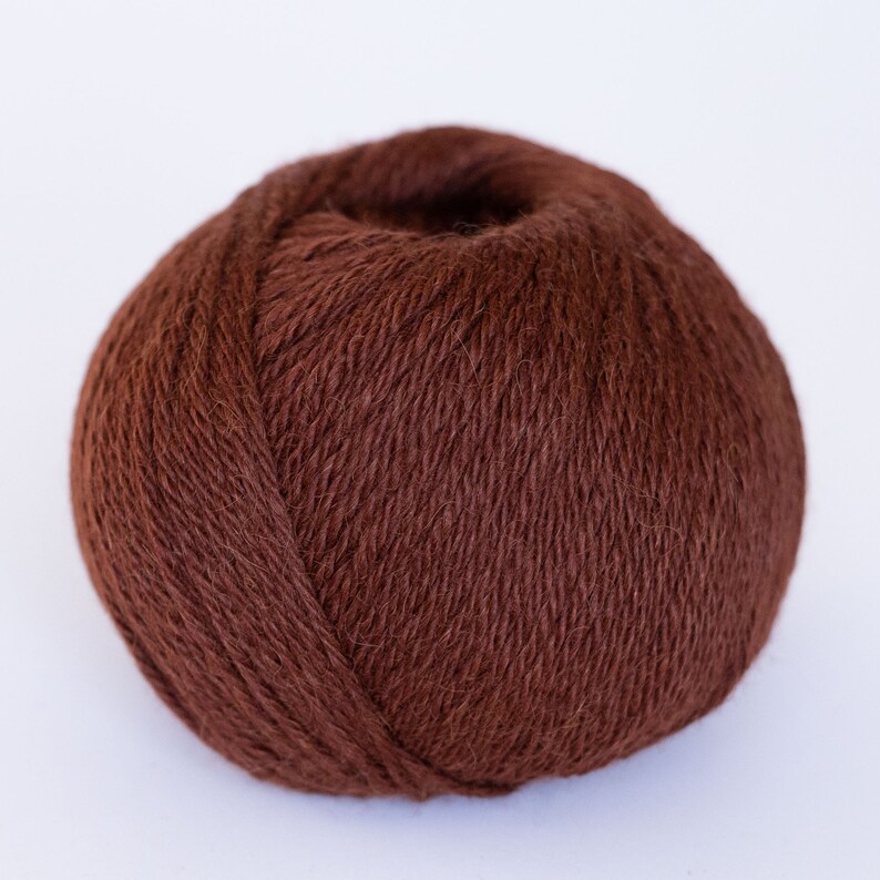 May include: A ball of brown yarn, perfect for knitting or crocheting.