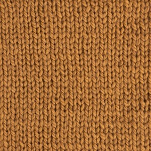 May include: Close-up of a brown knitted fabric with a textured pattern. The fabric is made of soft, fuzzy yarn.