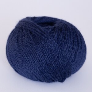 May include: A ball of dark blue yarn.