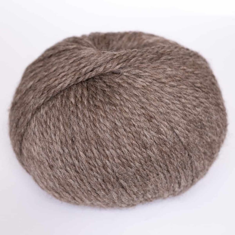 May include: A ball of brown yarn.