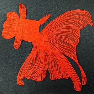 May include: A bright orange goldfish with a large, flowing tail fin, rendered in a detailed line art style against a black background.