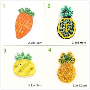 May include: Four beaded fruit patches, two pineapples and two carrots. The pineapple patches are yellow with green tops and the carrot patches are orange with green tops. The patches are 2.2x4.2 cm, 2.5x5.0 cm, 3.2x4.2 cm, and 2.2x4.5 cm.