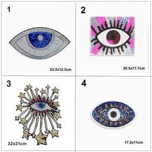 May include: Four different eye-shaped patches with colorful sequins and beads. The patches are 23.3x12.3 cm, 20.5x17.7 cm, 22x21 cm, and 17.2x11 cm.