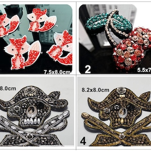 May include: Four iron-on patches for clothing or accessories. The first patch is a red and white fox, the second is a green and red cherry, the third is a black and silver skull and crossbones, and the fourth is a black and gold skull and crossbones. The patches are all approximately 8 cm in diameter.