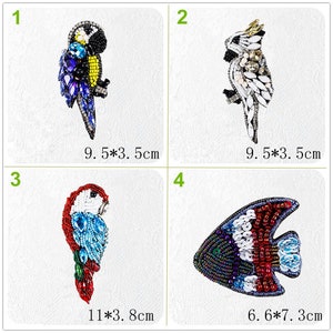 May include: Four beaded animal appliques, including a blue and yellow parrot, a white cockatoo, a red and blue parrot, and a red, white, and blue fish. The appliques are approximately 3.5 to 7.3 inches in size.