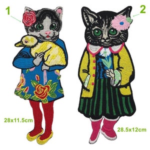 May include: Two embroidered iron-on patches featuring a cat with a flower in its ear. The first patch shows a cat holding a yellow duckling. The second patch shows a cat holding a flower. The patches are 28x11.5cm and 28.5x12cm.