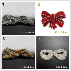 May include: Four different iron-on patches with rhinestone embellishments. The patches are a silver panther, a red bow, a gold panther, and a pair of white pearl sunglasses. The patches are all on a white background. The patches are 13.5x4.0 cm, 10.5x7.5 cm, 13.5x4.0 cm, and 9.0x3.6 cm.