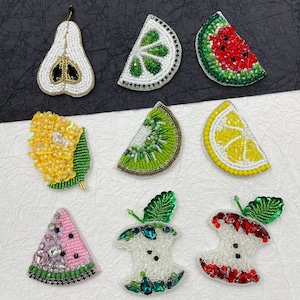 May include: Assortment of colourful beaded fruit patches, including a pear, lime, watermelon, kiwi, lemon, apple core, and a watermelon slice. These patches are perfect for adding a touch of whimsy to clothing, bags, or other accessories.