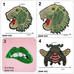 May include: Four iron-on patches with sequin embellishments. The patches are a green and gold tiger head, a green and gold tiger head, a green lip, and a green and gold bee. The patches are all approximately 14.5 cm wide and 16.5 cm tall.