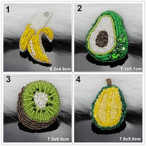 May include: Four embroidered iron-on patches featuring different fruits: a yellow banana, a green avocado, a green kiwi, and a yellow pear. Each patch is approximately 7.5 cm in size.
