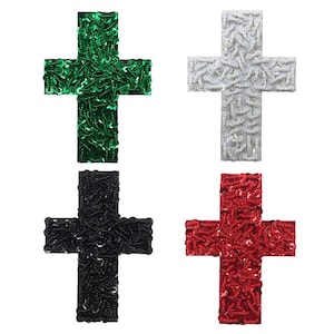 May include: Four sequined cross patches in green, white, black, and red. Each cross is made of small, round sequins.
