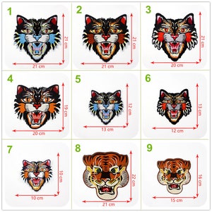 May include: Nine embroidered iron-on patches featuring colorful animal faces. The patches are in various sizes, ranging from 10 cm to 22 cm. The animals include tigers and cats with fierce expressions.