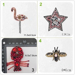 May include: Four embroidered iron-on patches featuring a pink flamingo, a pink and black star, a red lobster, and a black and gold bee. The patches are approximately 11.5 x 5.5 cm, 8.2 x 8.2 cm, 6.5 x 7.0 cm, and 4 x 6 cm.