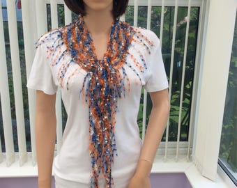 Easy wear fashion  scarf in a pretty mix of orange, blue and white. Suitable for any occasion, stunning scarf, eye catching scarf, modern,