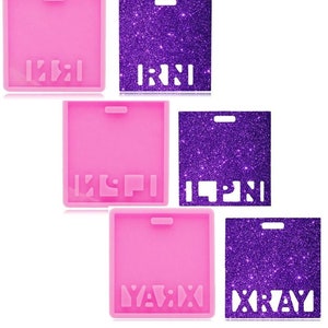 May include: Three sets of silicone molds for making resin keychains. Each mold is pink and features a different word: "KXI", "KCPI", and "YAVIX". The molds are shown next to purple glitter sheets with the same words cut out.