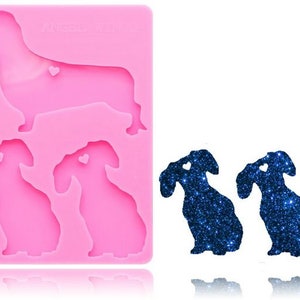 May include: A pink silicone mould with the text "ANGELY'S THINGS" and four dachshund shapes. Two blue glitter dachshund shapes are shown next to the mould.