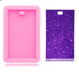 May include: Pink silicone mold for making resin crafts. The mold is rectangular with a hole at the top for a keychain or pendant. The mold is shown next to a purple glitter sheet.