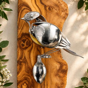 Whimsical upcycled cutlery Robin – indoor wall accent.