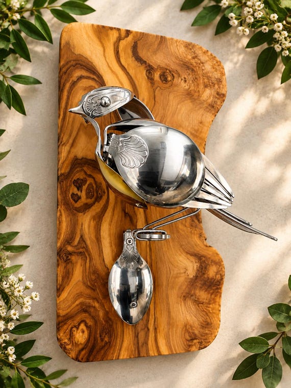 Whimsical upcycled cutlery Robin – indoor wall accent.