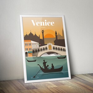 May include: A vintage travel poster with a silhouette of Venice, Italy. The poster features a view of the Rialto Bridge with gondolas in the water and a sunset in the background. The text "Venice, Italy" is printed in white at the top of the poster.