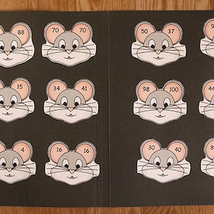 May include: A set of 12 mouse-shaped cards with numbers on them. The cards are on a black background. The numbers on the cards are 67, 88, 70, 70, 50, 37, 95, 91, 25, 15, 34, 41, 98, 100, 44, 78, 0, 4, 16, 16, 30, 40, 83, and 67.