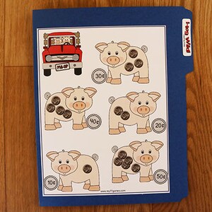 May include: A printable worksheet featuring a red pick-up truck and four piggy banks with varying amounts of coins. The piggy banks have the amounts 10p, 20p, 30p, 40p, and 50p written next to them. The worksheet is titled "Hog Wild".