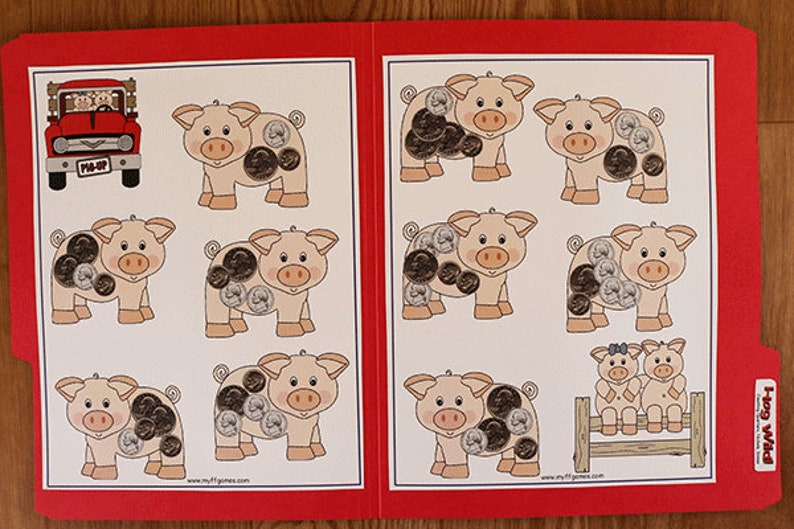 May include: A red truck with the words "Pig-Up" on the side, with two pigs inside. There are eight pig illustrations with coins on them. The text "Hog Wild" is on the right side of the image.