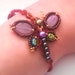 Bracelet Butterfly in metallic red tatting lace woven puck purple pearls and iridescent black