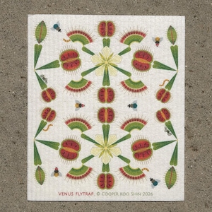 May include: A rectangular white cleaning cloth featuring a repeating pattern of green and red Venus flytrap plants, pale yellow flowers, and small insects. The text VENUS FLYTRAP © COOPER KOO SHIN 2026 is printed in red and black at the bottom.