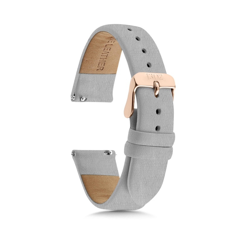 May include: A light grey watch strap made of leather with a rose gold-toned metal buckle. The strap features a series of adjustment holes and two loops to secure the end. The interior side is stamped with the text GENUINE LEATHER.