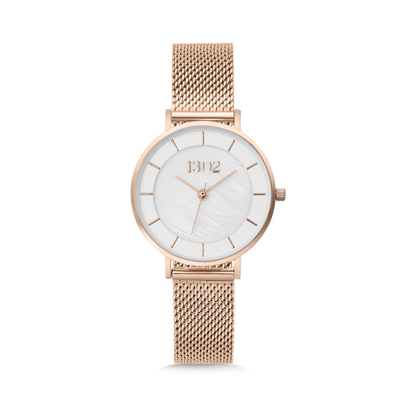 May include: A rose gold watch with a white face and a mesh band. The watch face has a white mother-of-pearl dial with a rose gold 1302 logo.