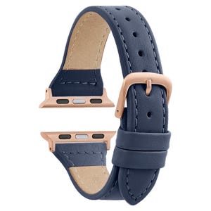 May include: A dark blue leather watch band with rose gold hardware and stitching. The band is designed for Apple Watch.