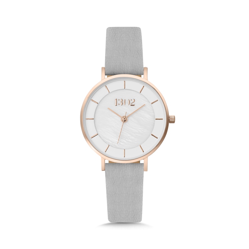 May include: A white analog wristwatch with a rose gold case and hands. The watch has a white leather band and a white face with a mother-of-pearl texture. The watch face has black Roman numeral hour markers and a small seconds hand. The watch face also has the text "1302" printed on it.