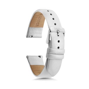 May include: A white leather watch strap featuring a silver-toned metal buckle and a series of adjustment holes. The inner side of the strap is lined with tan material and includes the embossed text GENUINE LEATHER, while the buckle is marked 131Y2.
