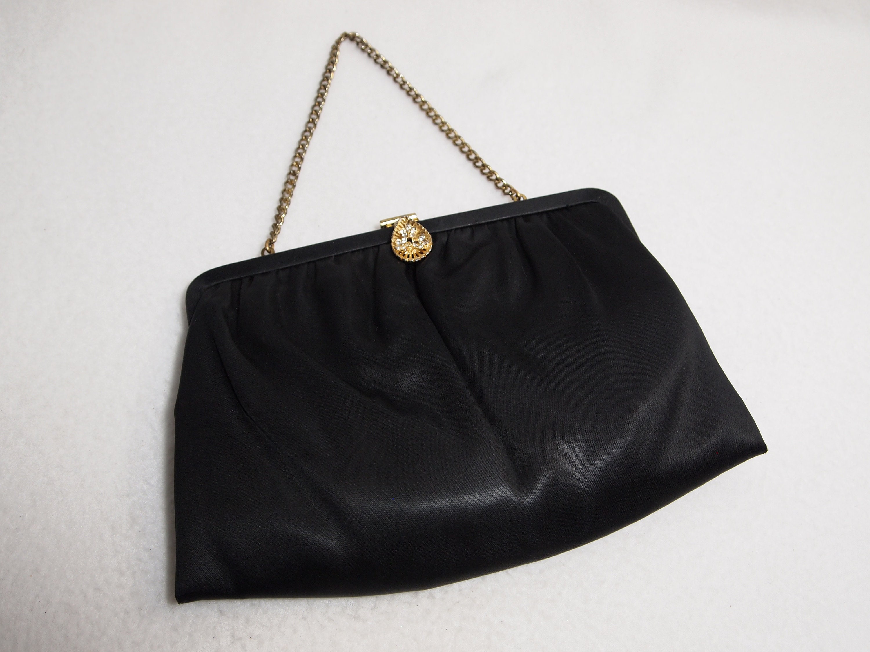 Lot 262 - A vintage Chanel black satin evening bag