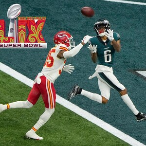 May include: A football player in a green and white uniform with the number 6 jumps to catch a football thrown by a player in a red and white uniform. The background is a green football field. The text "LIX SUPER BOWL" is visible in the top left corner of the image.