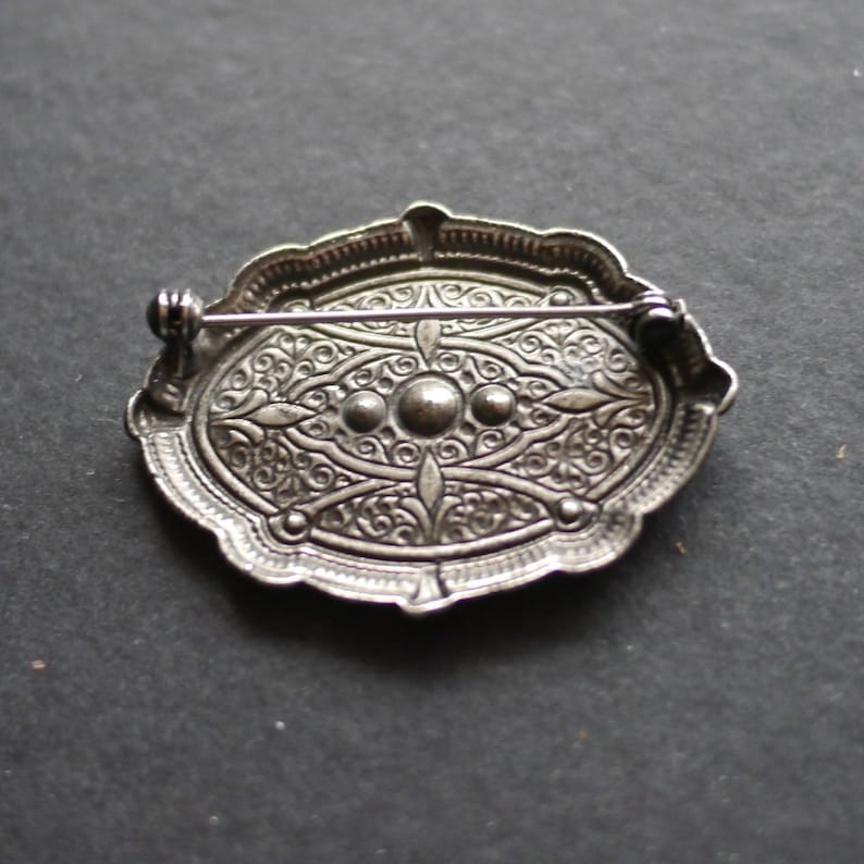 Ornate silver tone metal vintage brooch with clear rhinestones image 3