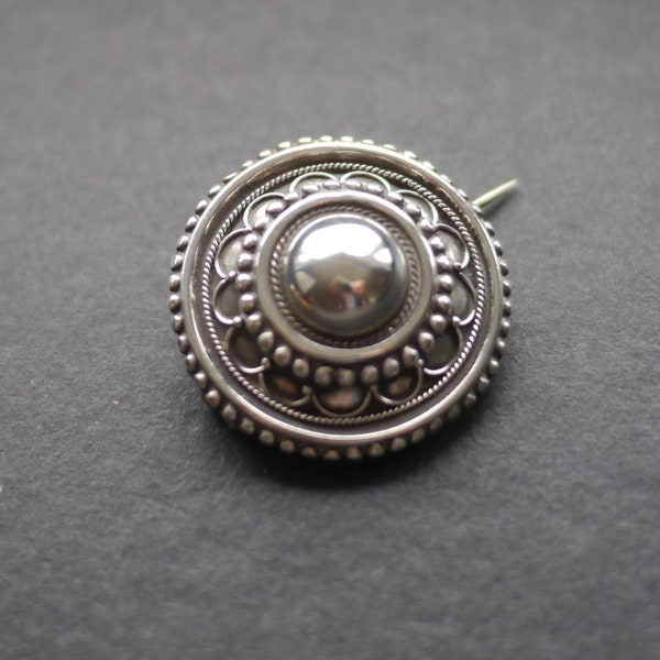 Victorian white metal locket back target brooch