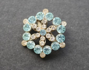 Vintage brooch with clear and blue rhinestones, six sided