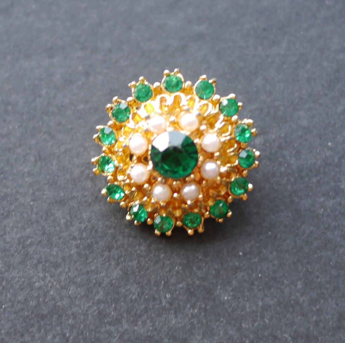 Small gold tone brooch with green rhinestones and white faux pearl beads