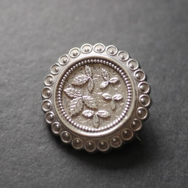 Victorian white metal locket back mourning brooch with engraved leaves (no glass)