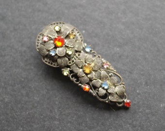 Art deco dress clip, filigree metal with coloured rhinestones