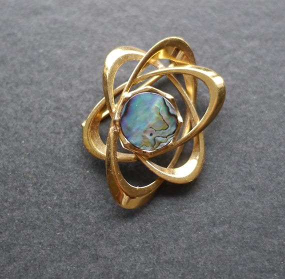 Vintage modernist, atom gold tone metal brooch with a… - Gem