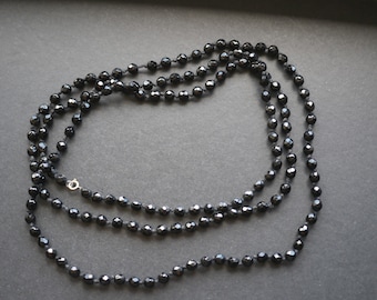 Art deco knotted glass beaded necklace, black glass flapper length