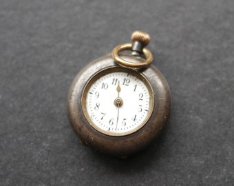 Small Victorian pocket watch, missing glass not working