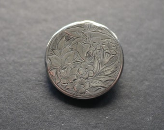 Victorian silver brooch with engraved flower and leaf design