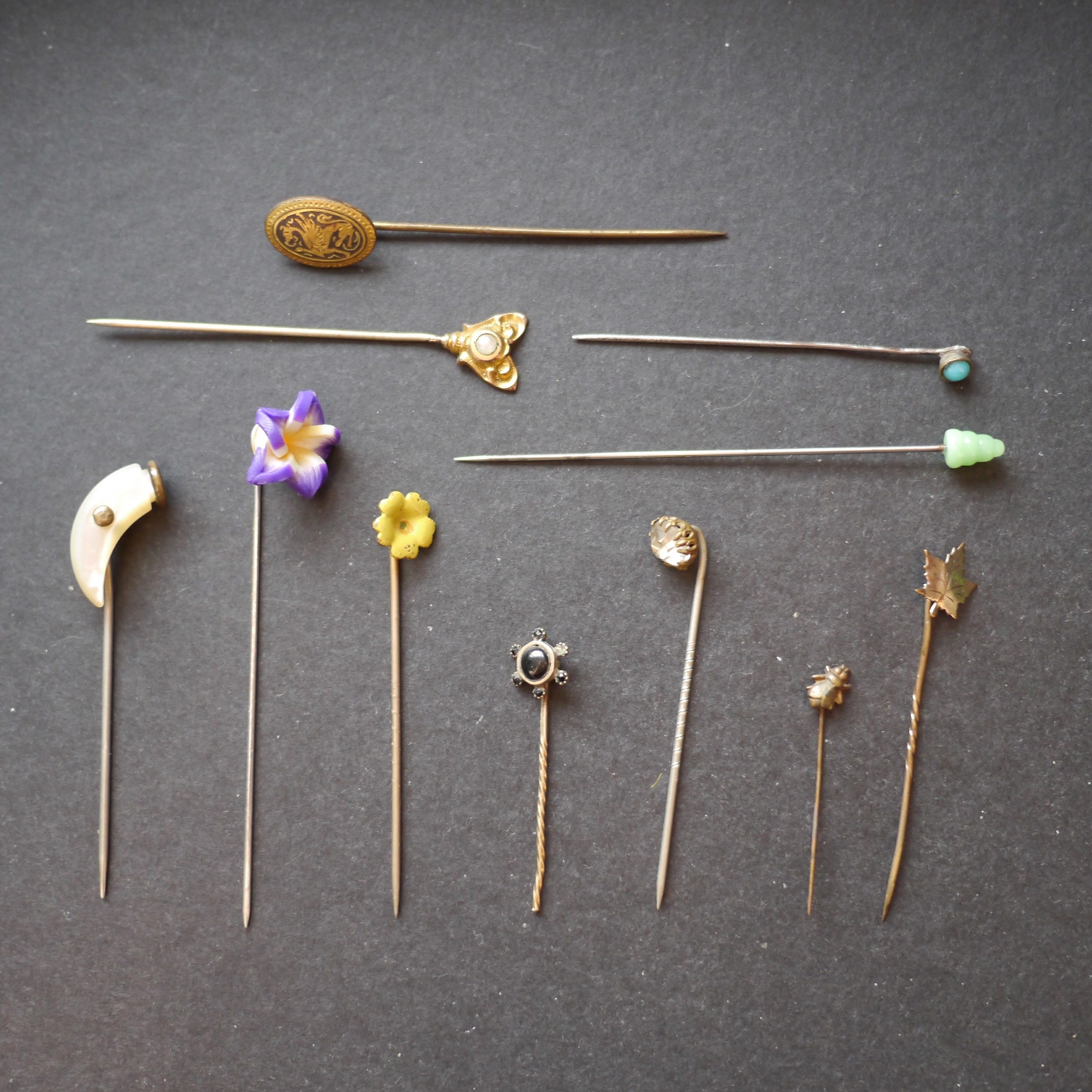 COLLECTION OF ELEVEN VINTAGE GOLD STICK PINS
