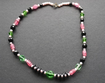 Glass bead necklace, pink black green and white